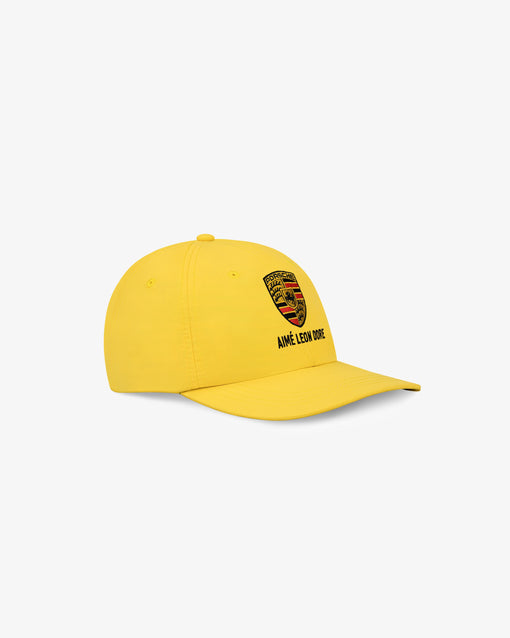 Boné Aimé Leon Dore x Porsche Nylon Logo "Aspen Gold" Amarelo